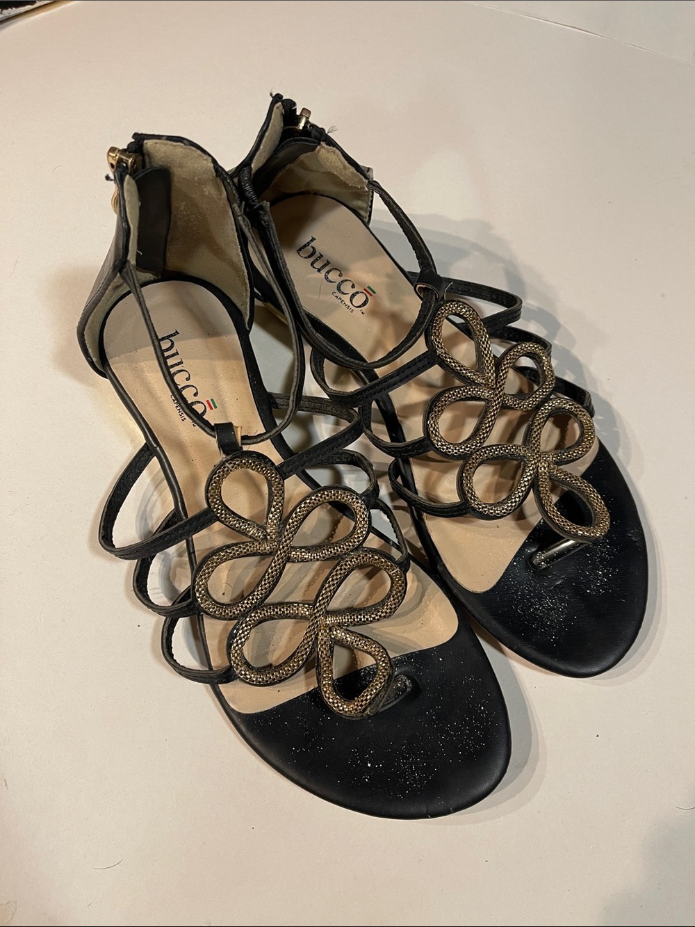 bucco Black Sandals with Gold Loop Embellishments